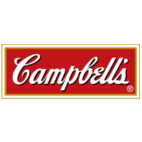 A modern office space showcasing Campbell's branding, featuring a desk, computer, and vibrant decor.